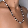 collier porté gardien du silence